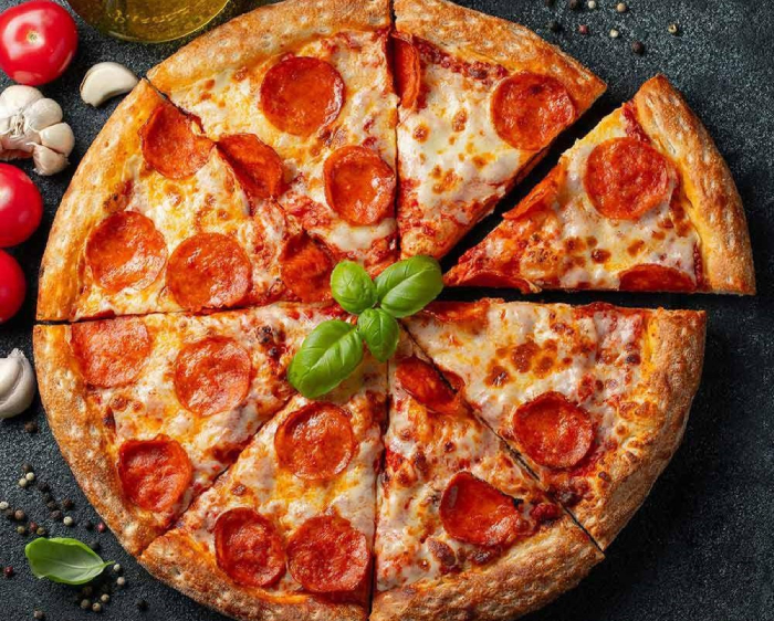 Pepperoni pizza from Darin's in Edinburgh with basil, tomato and garlic.